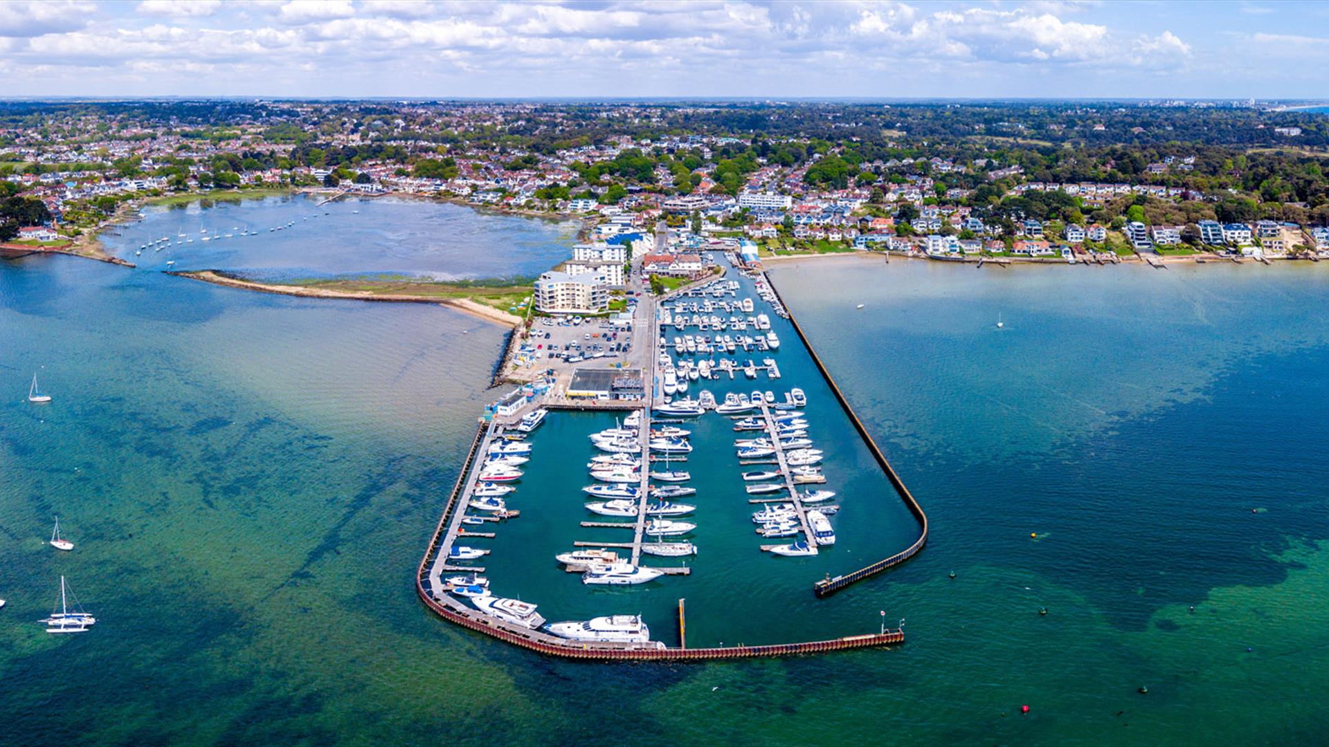 Drone shot of Poole area with boats moored on docking area