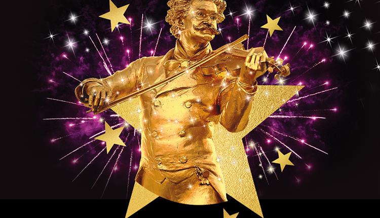 Inside a star graphic is a golden statue of Strauss playing the violin.