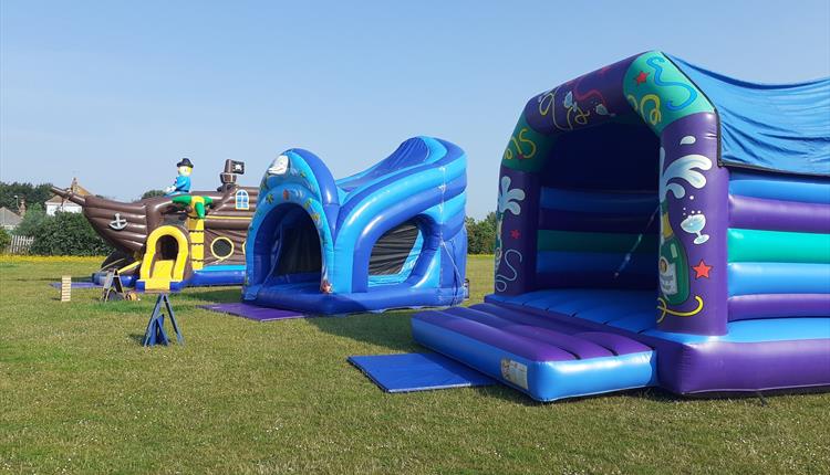 Picture of three bouncy castles