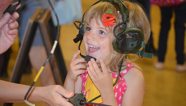 Young girl interacting with the communication equipment