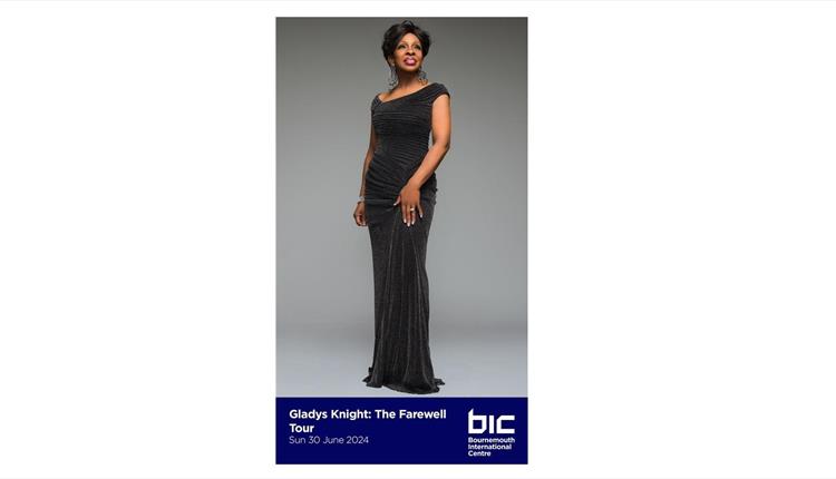 Gladys Knight in a black floor length dress smiling