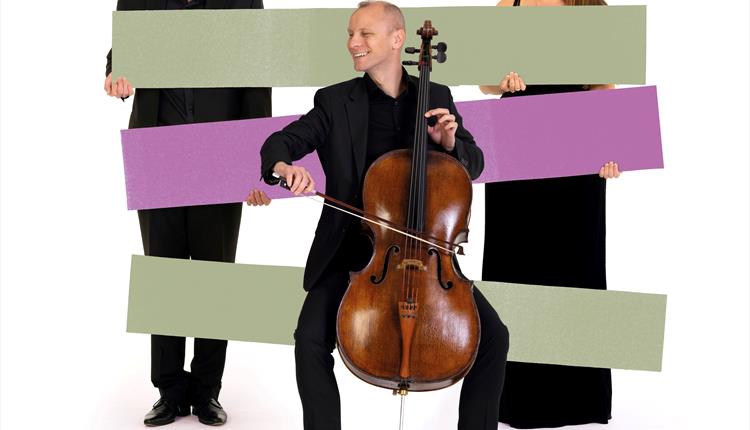 Image of 3 BSO musicians, one playing a cello