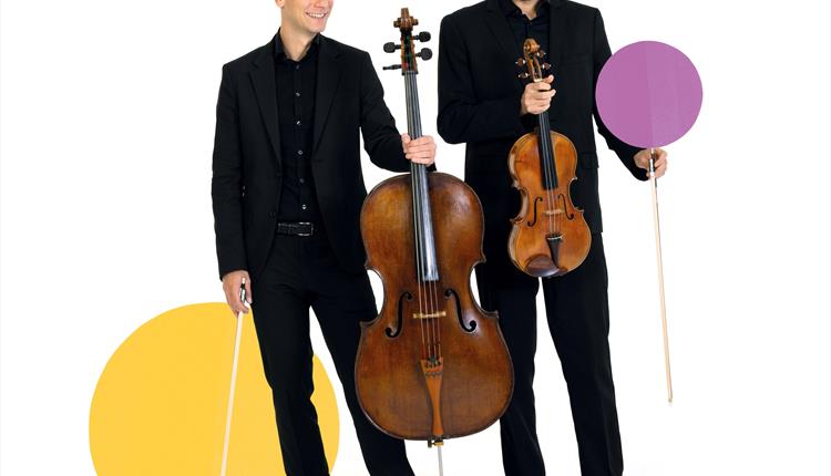 Image of 2 BSO musicians, one holding a cello and another holding a viola