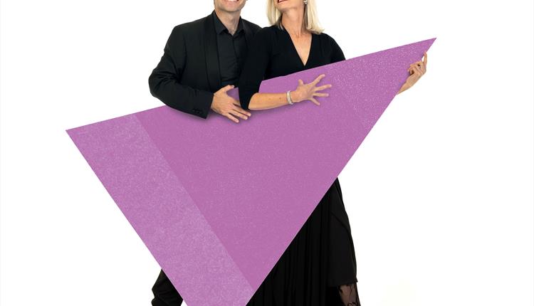 Image of 2 BSO musicians holding a triangle