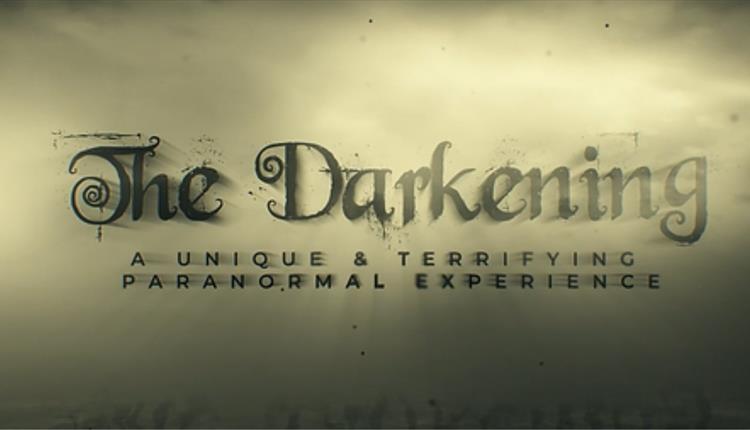 The Darkening text with a spooky background