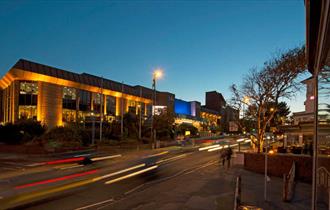 BIC lit up at night taken from across the street in bournemouth