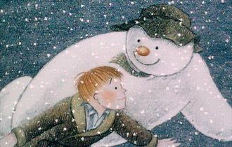 An image from the animated film 'The Snowman', the snowman is holding James as they fly over London.