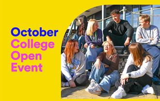 A group of seven college students sitting on the steps laughing and talking.