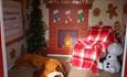 Shot of the inside the cosy gingerbread beach hut house decked out in Christmas decorations