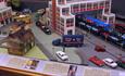 Model cars and road with buildings