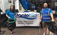 Two volunteers of the clean up stand proudly in the high street