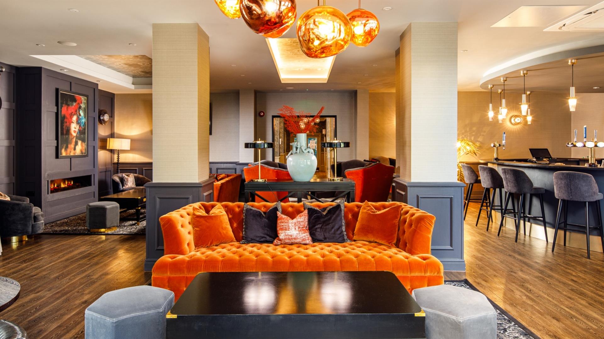 Inside a hotel bar area with colourful decor throughout
