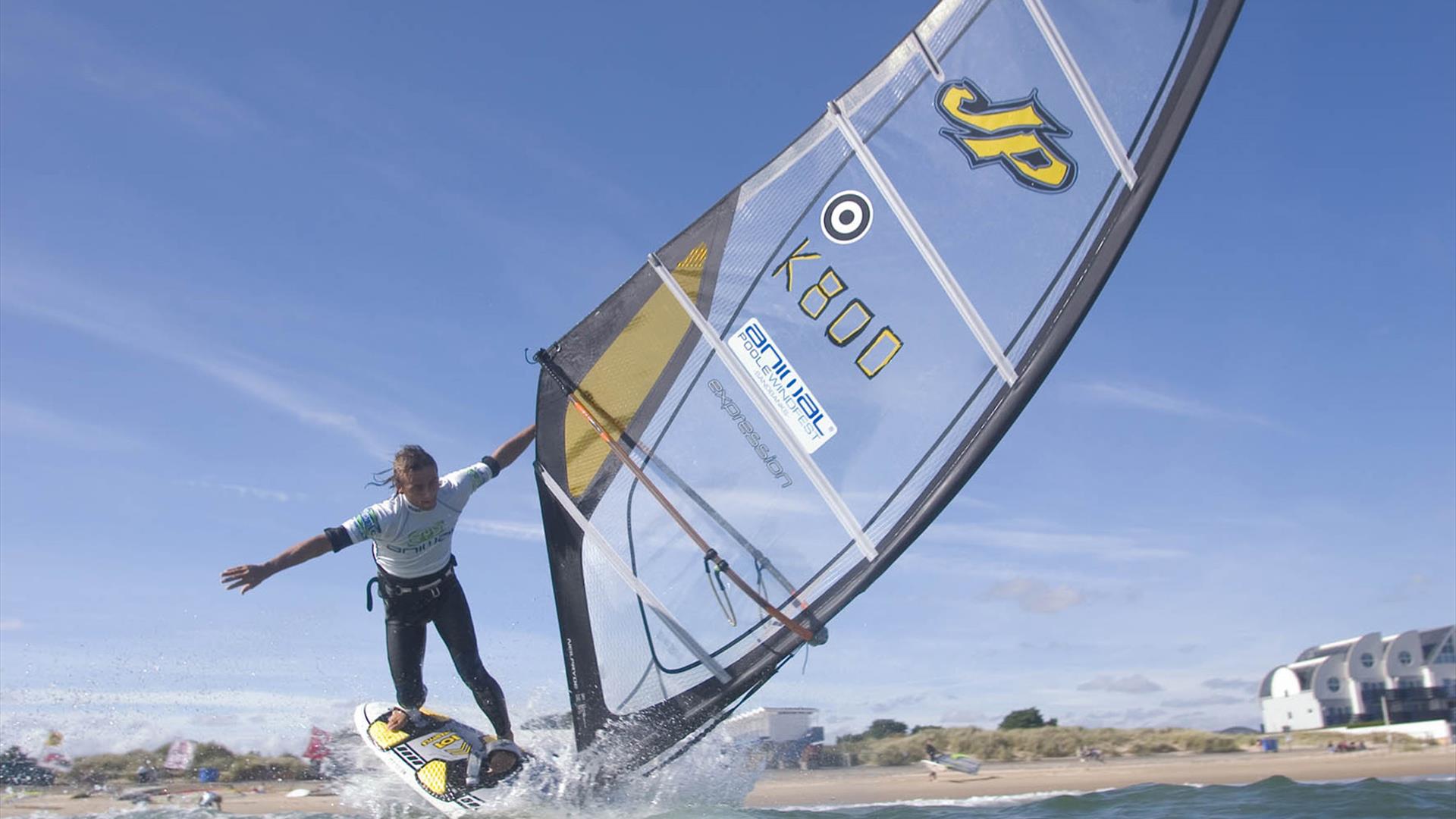 Man windsurfing in Poole harbour