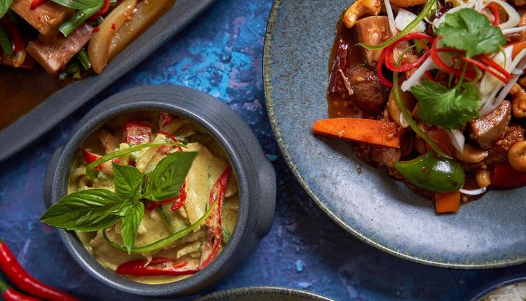 Delicious Thai food in bowls and on a plate.