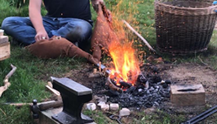 A fire being used to turn stone into metal