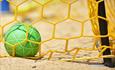 Football and net on the beach