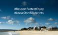 Sandbanks beach with message overlay: #RespectProtectEnjoy #LeaveOnlyFootprints