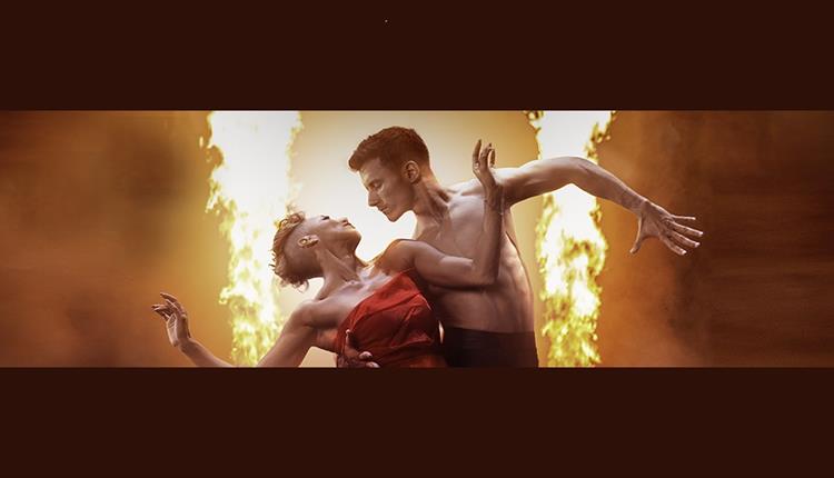 Dancers Karen Hauer & Gorka Marquez come together with a flame illuminating their bodies