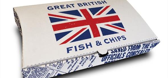 A box of fish and chips with a Great Britain flag in the middle 