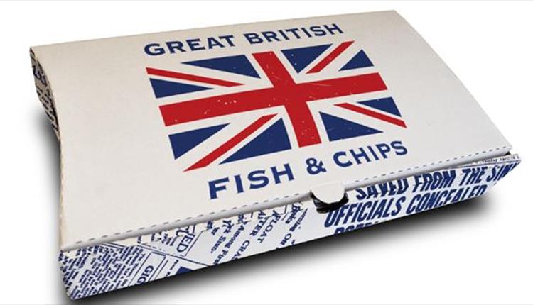 A box of fish and chips with a Great Britain flag in the middle