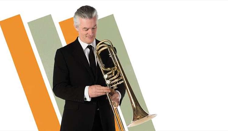 Man in a suit with musical instrument