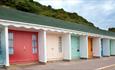 row of beach huts at branksome dene in poole