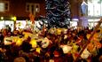 Poole residents celebrate the hanging of lanterns around the Christmas tree.