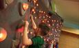 Kid on illuminated climbing wall