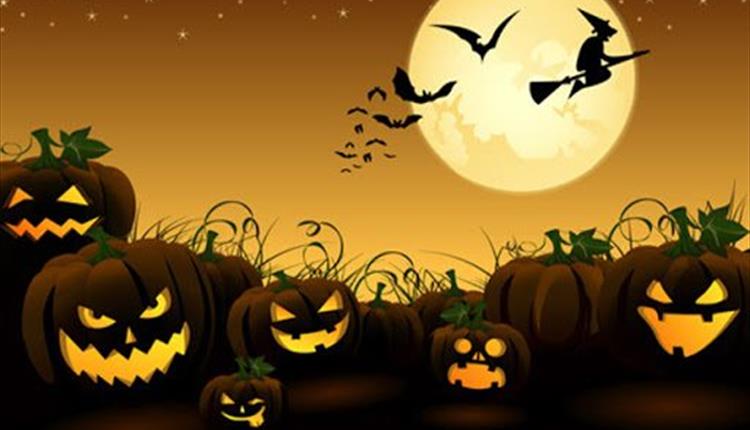 Cartoon pumpkins, bats and a witch flying across the moon