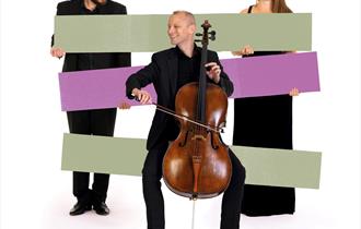 Image of three BSO musicians, one playing the cello