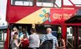 Families ready to hop on the City sightseeing bus in Bournemouth