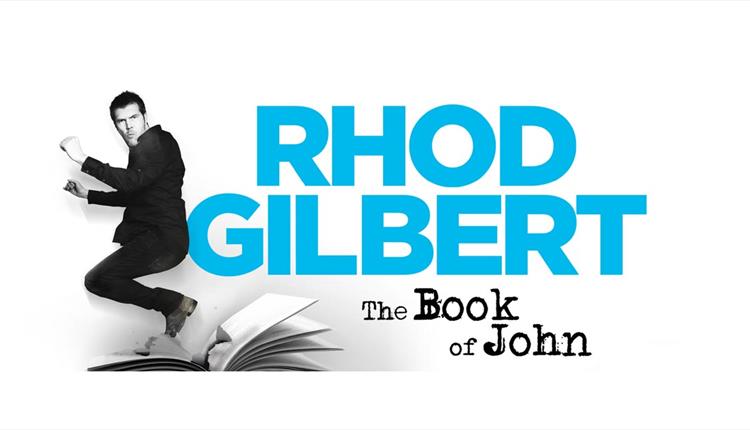 Rhod Gilbert jumping above an open page book with his name in bright blue, against black and white background
