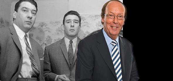 Kray twins in a black and white picture with Fred Dinenage standing next to it 