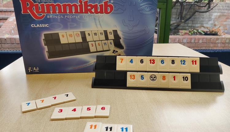 Rummikub box with tiles from the game