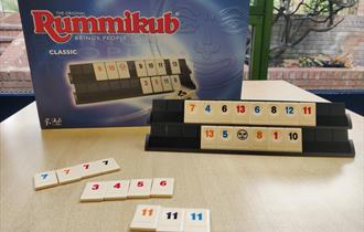 Rummikub box with tiles from the game