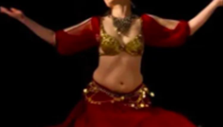 Woman dressed in red and gold dress on stage