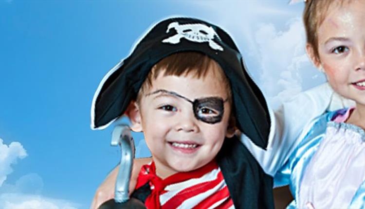two children pictured in pirate and princess outfits.
