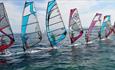 Wind surfers lining up their colourful gear in Poole Harbour