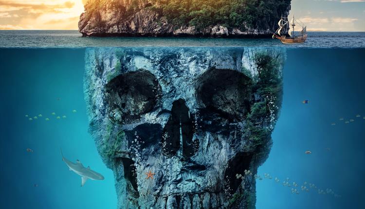 Skull under water with island on top of head on water