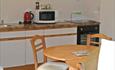 Shot of the table and kitchen area of one of the holiday apartments