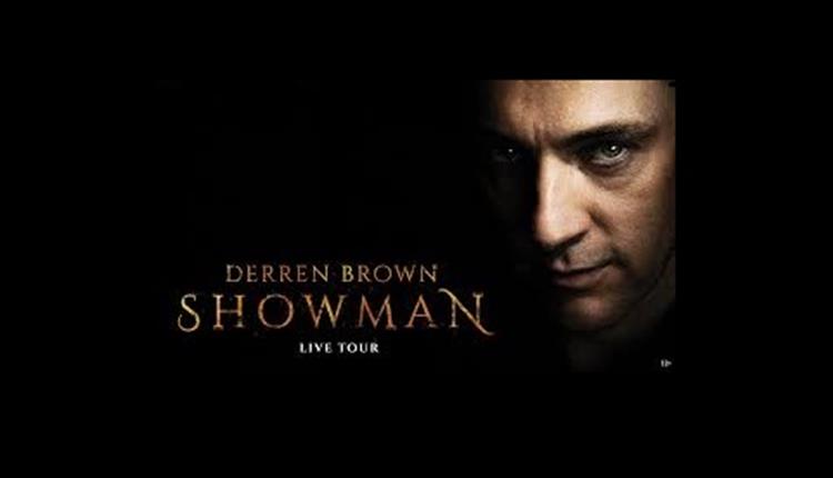 derren brown lloking at camera with dark background and his name in text to the left