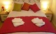 Double bed with warm colours