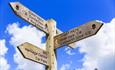 Signpost Lulworth Cove and Durdle Door Discover Dorset Tours