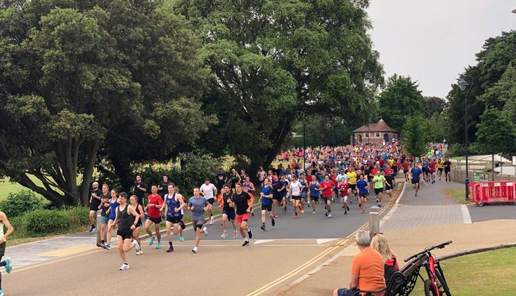 Runners in Poole park running in Poole parkrun