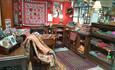 a room of rugs and textiles