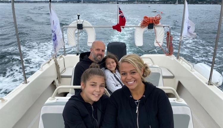 Family enjoying boat ride