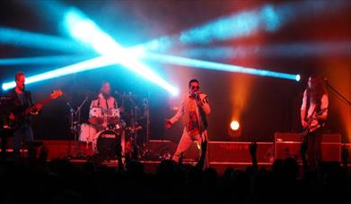 picture of Queen tribute band performing.