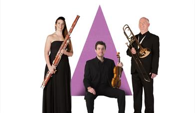 Three members of the Bournemouth Symphony Orchestra with their instruments