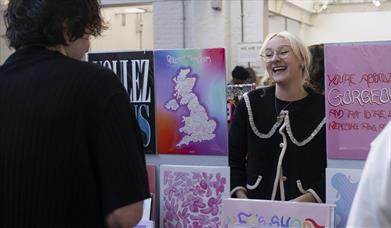 A trader and a punter at a 'Craft & Flea' Makers Market