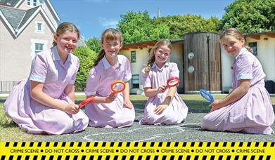 Four girls take part in the Forensic Science Trail at Portsmouth High School